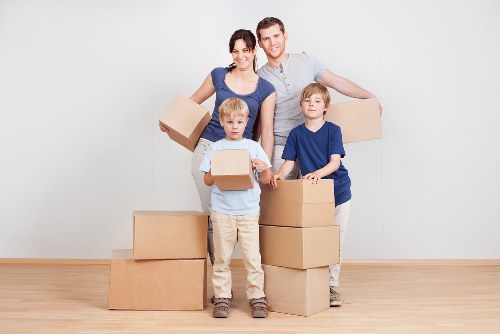 Careful loading of bulky household items into a van