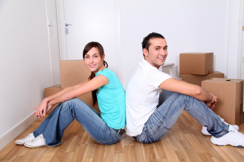 Man with van loading furniture for a local move in Epsom
