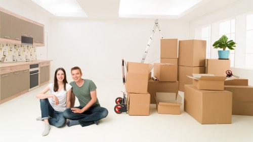 Local team collecting sofas and beds from an Epsom property